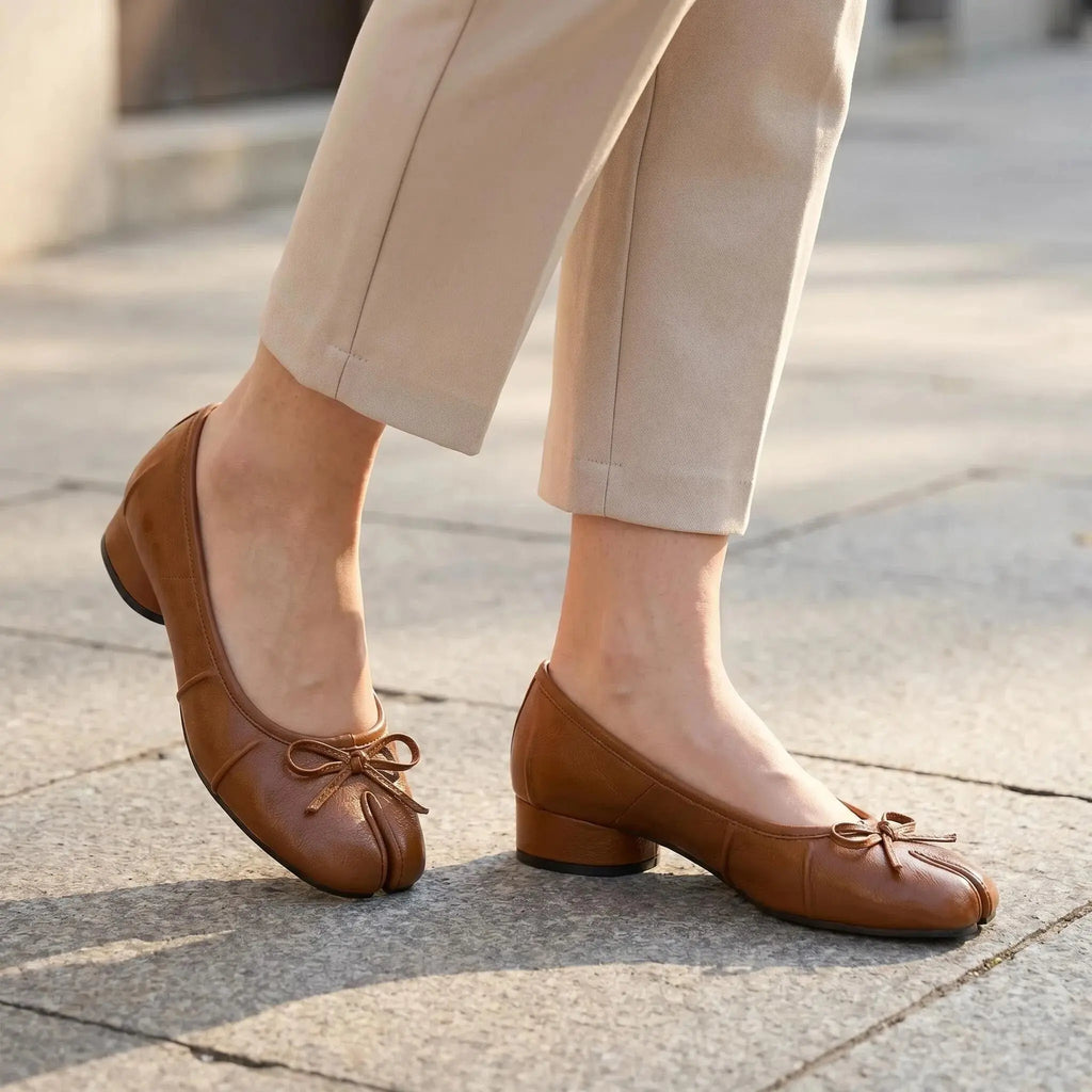ZQW Bow Tabi Heel in bronze, worn on feet close-up – split-toe fit, bow embellishment, comfortable block heel, wide-foot friendly
