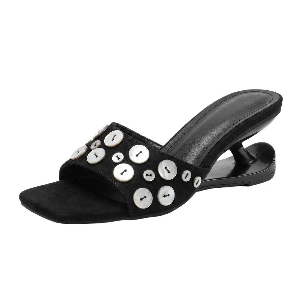 ZQW Button Chunky Mules in black, 45-degree angle view – sculptural curved heel, open square toe, statement button detail, backless slip-on vegan leather mule