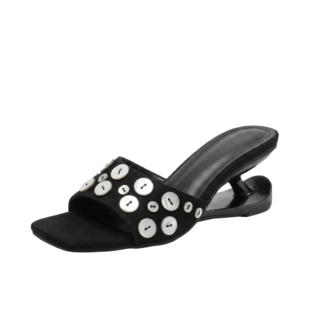 ZQW Button Chunky Mules in black, 45-degree angle view – sculptural curved heel, open square toe, statement button detail, backless slip-on vegan leather mule