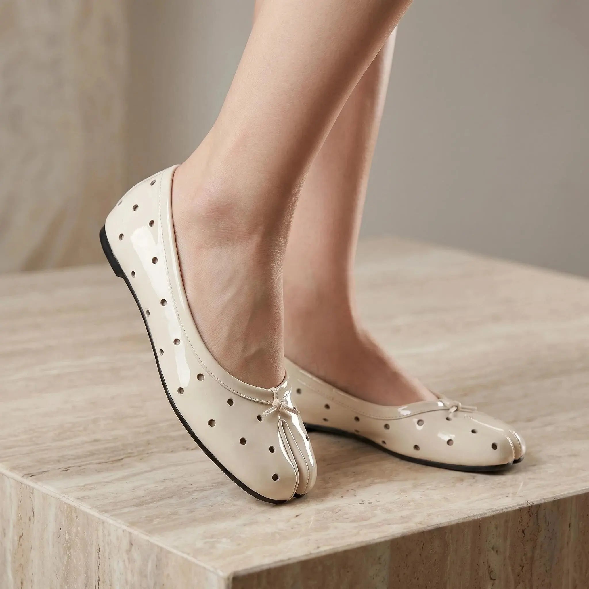 ZQW Cutout Polka Dot Tabi Flats in white, worn on feet close-up – tabi toe separation allows natural movement, breathable dotted upper, all-day comfort