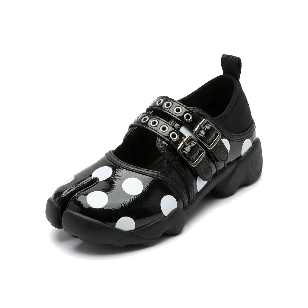 ZQW Dotty Split 1.0 Tabi Mary Jane Sneakers in black with bold polka dots, 45-degree angle view – chunky white or contrasting dots on black base, split-toe design, Mary Jane strap, cushioned sneaker sole