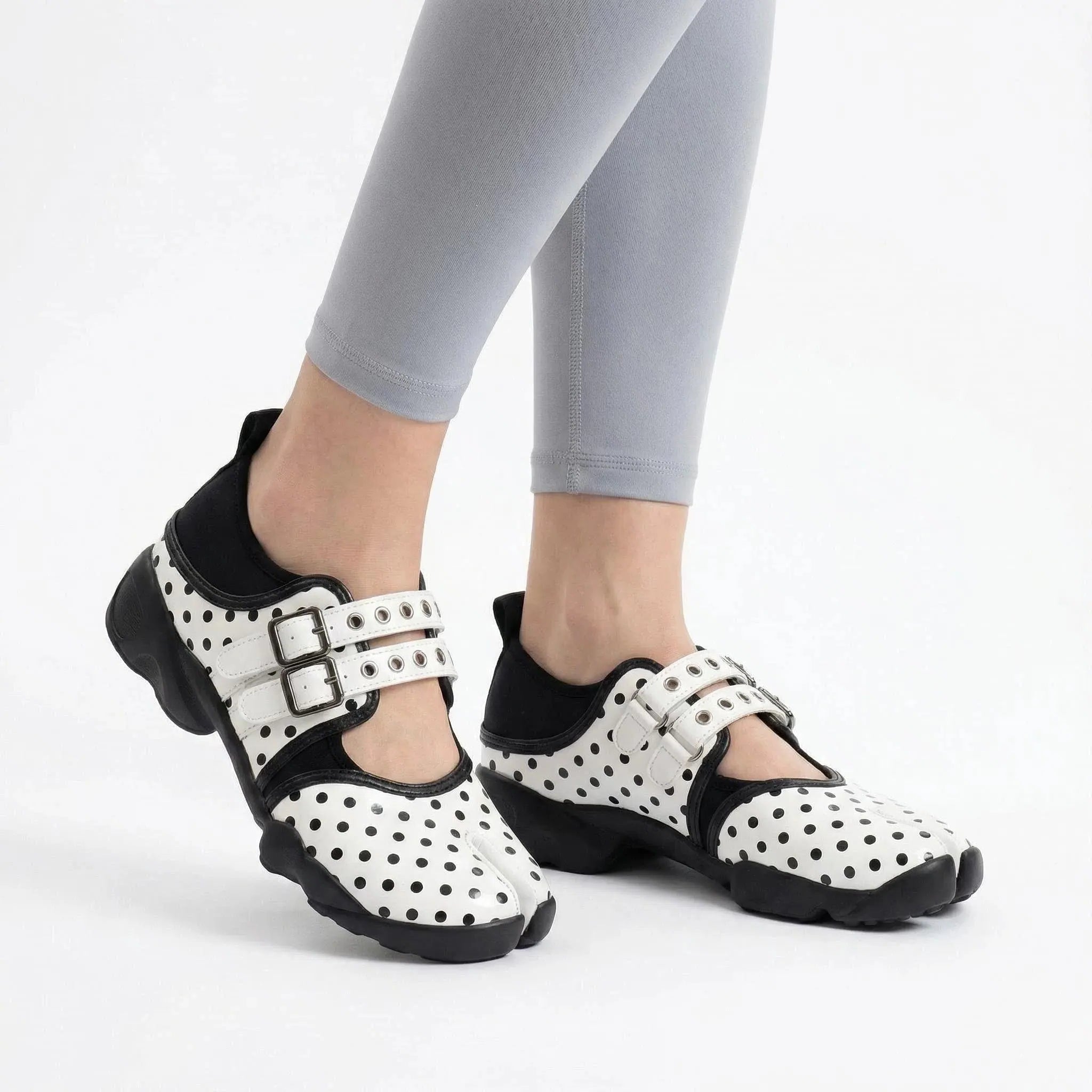 ZQW Dotty Split 1.0 white small dot sneakers worn on feet – delicate polka dot pattern adds subtle charm, split-toe fit, Mary Jane strap for secure hold, cushioned insole for comfort