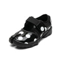 ZQW Dotty Split 2.0 Tabi Mary Jane Sneakers in black with bold polka dots, 45-degree angle view – chunky white dots on black base, split-toe design, hook & loop closure, cushioned sneaker sole