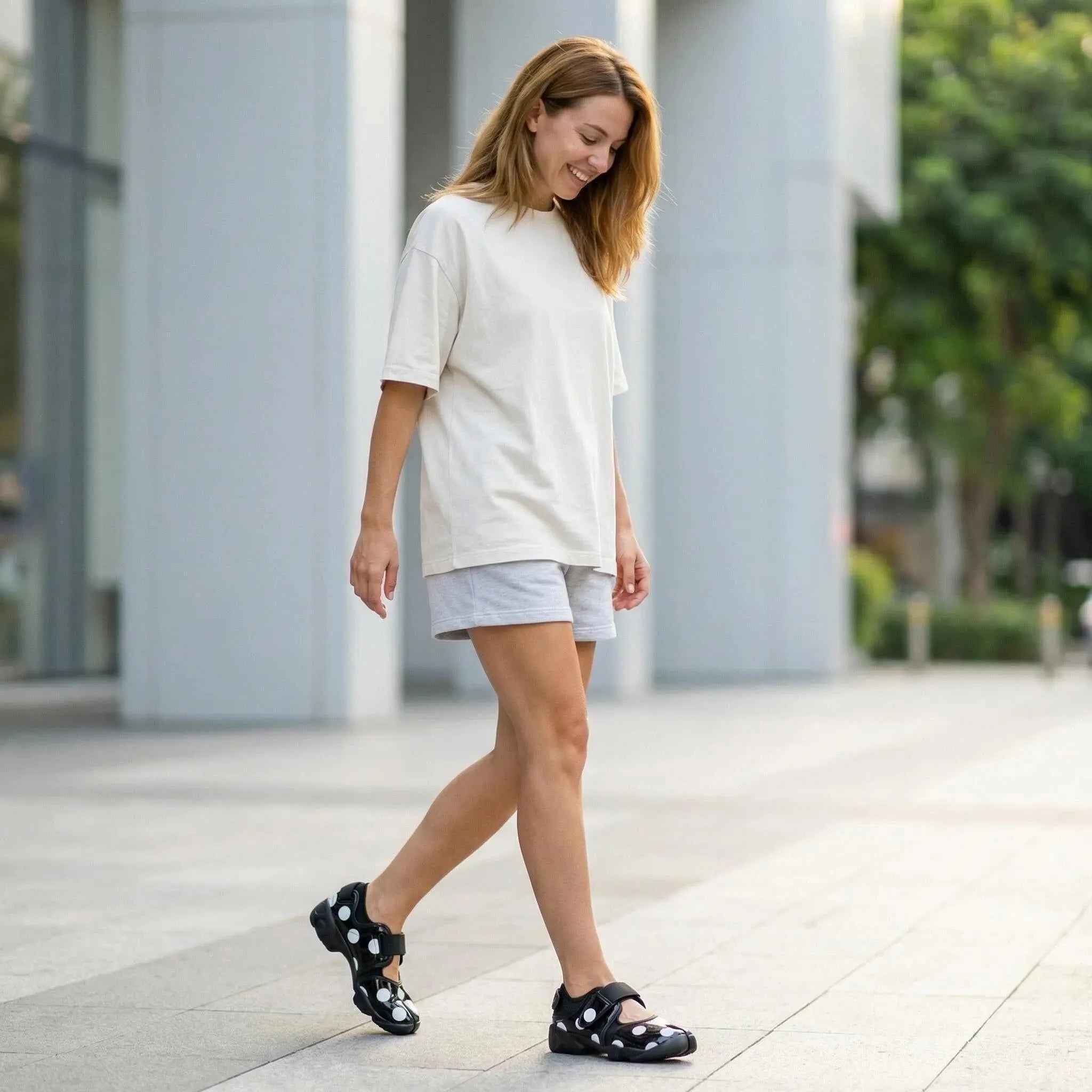 ZQW Dotty Split 2.0 Tabi Mary Jane Sneakers in black polka dot, model wearing – playful bold dot print with hook & loop closure, comfortable Mary Jane tabi sneakers, great for street style or everyday wear