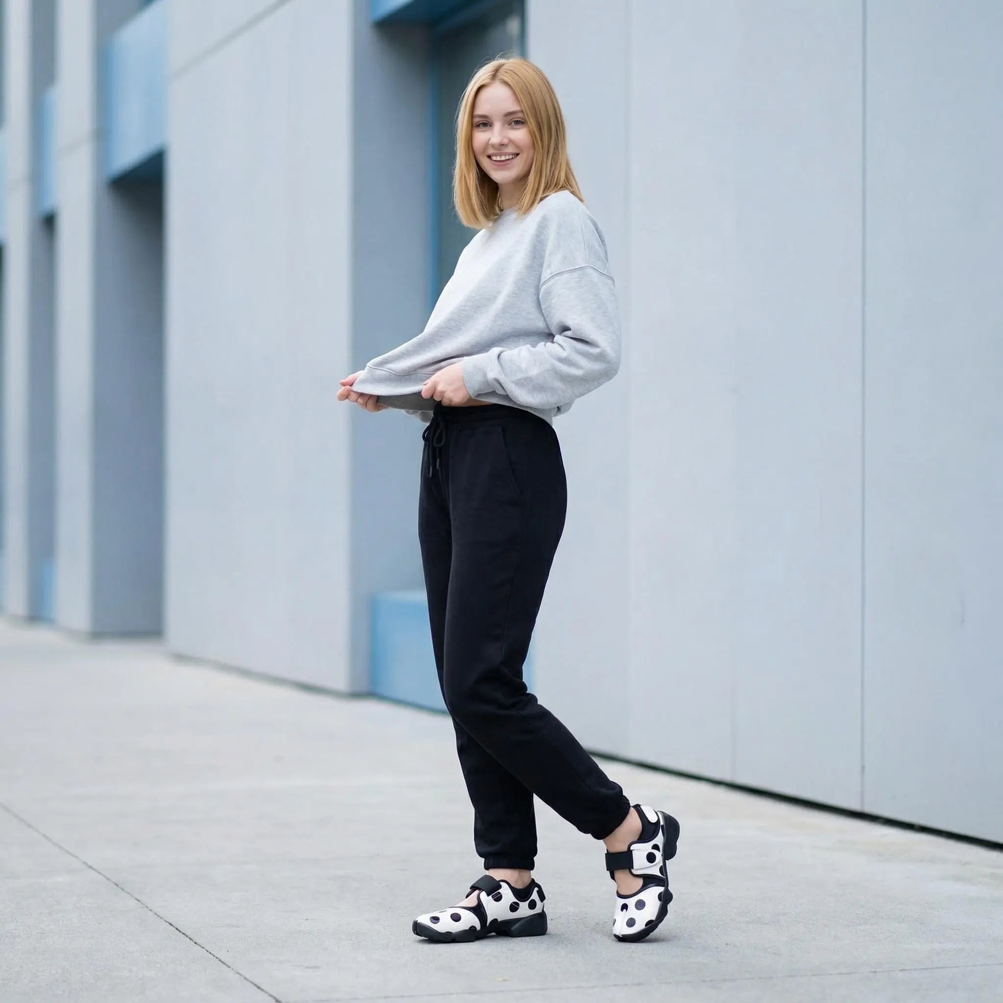 ZQW Dotty Split 2.0 Tabi Mary Jane Sneakers in white polka dot, model wearing – playful bold dot print with hook & loop closure, comfortable Mary Jane tabi sneakers, great for street style or everyday wear
