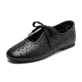 ZQW Lace-Up Cutout Floral Mary Janes in black, 45-degree angle view – laser-cut flower pattern, lace-up front closure, round toe, breathable ballet flat