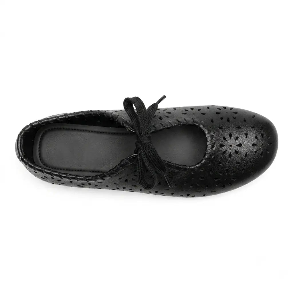 ZQW Lace-Up Cutout Floral Mary Janes in black, top view – floral cutout detailing across upper, lace-up ribbon ties, round toe silhouette, cushioned insole