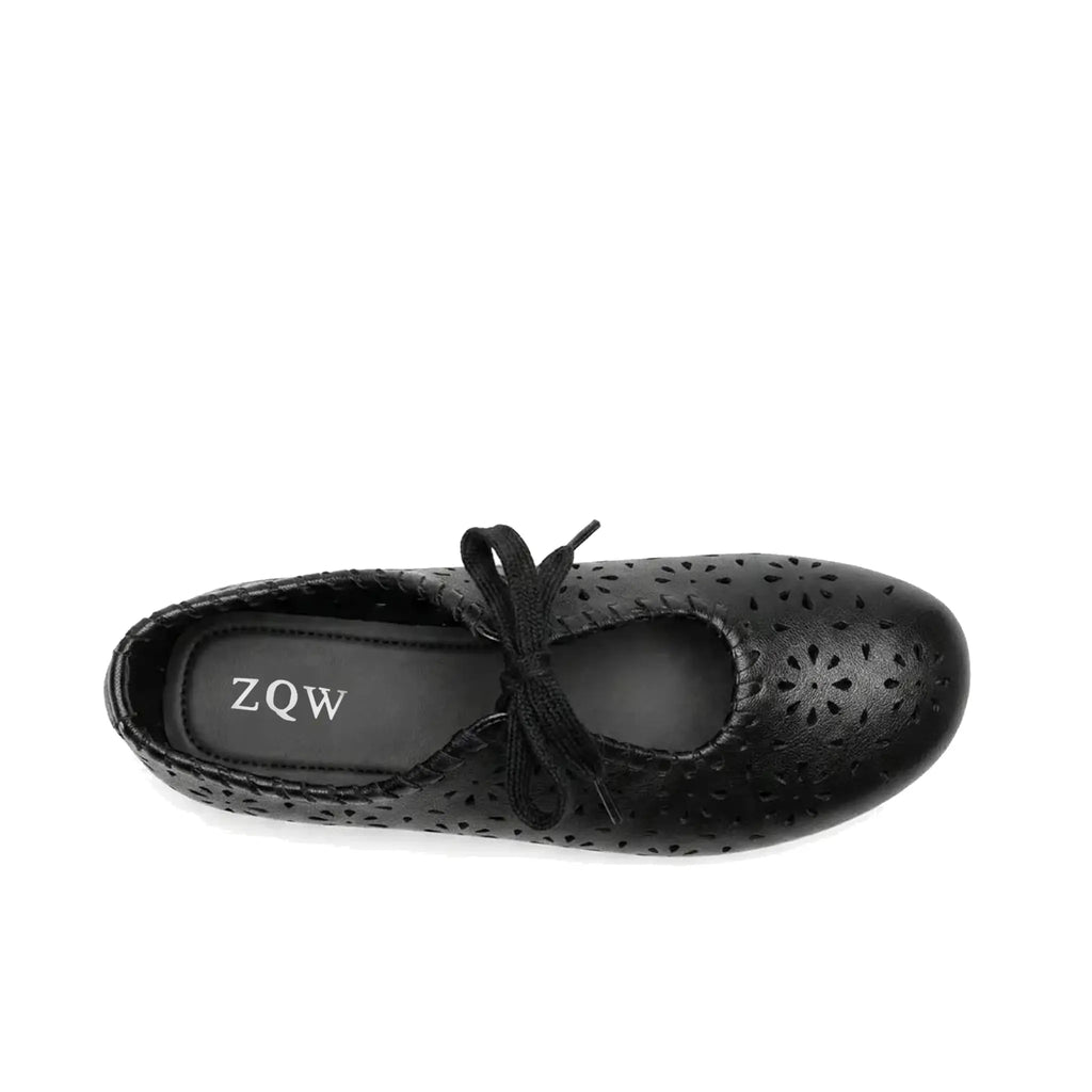 ZQW Lace-Up Cutout Floral Mary Janes in black, top view – floral cutout detailing across upper, lace-up ribbon ties, round toe silhouette, cushioned insole