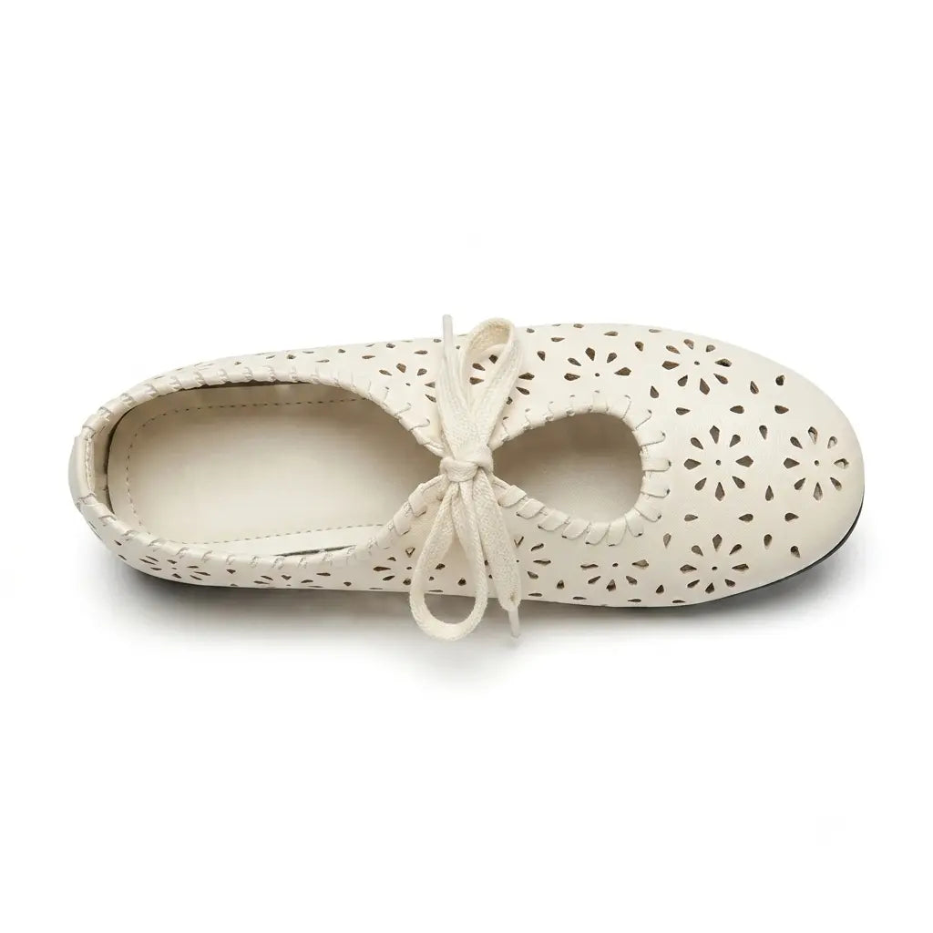 ZQW Lace-Up Cutout Floral Mary Janes in white, top view – floral cutout detailing across upper, lace-up ribbon ties, round toe silhouette, cushioned insole