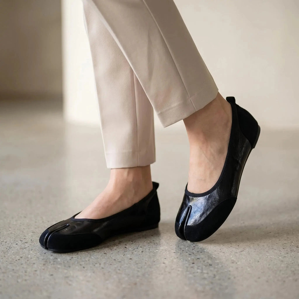 ZQW Mixed Media Tabi Flats in black, worn on feet close-up – split-toe fit allows natural movement, mixed material texture, cushioned insole for all-day comfort