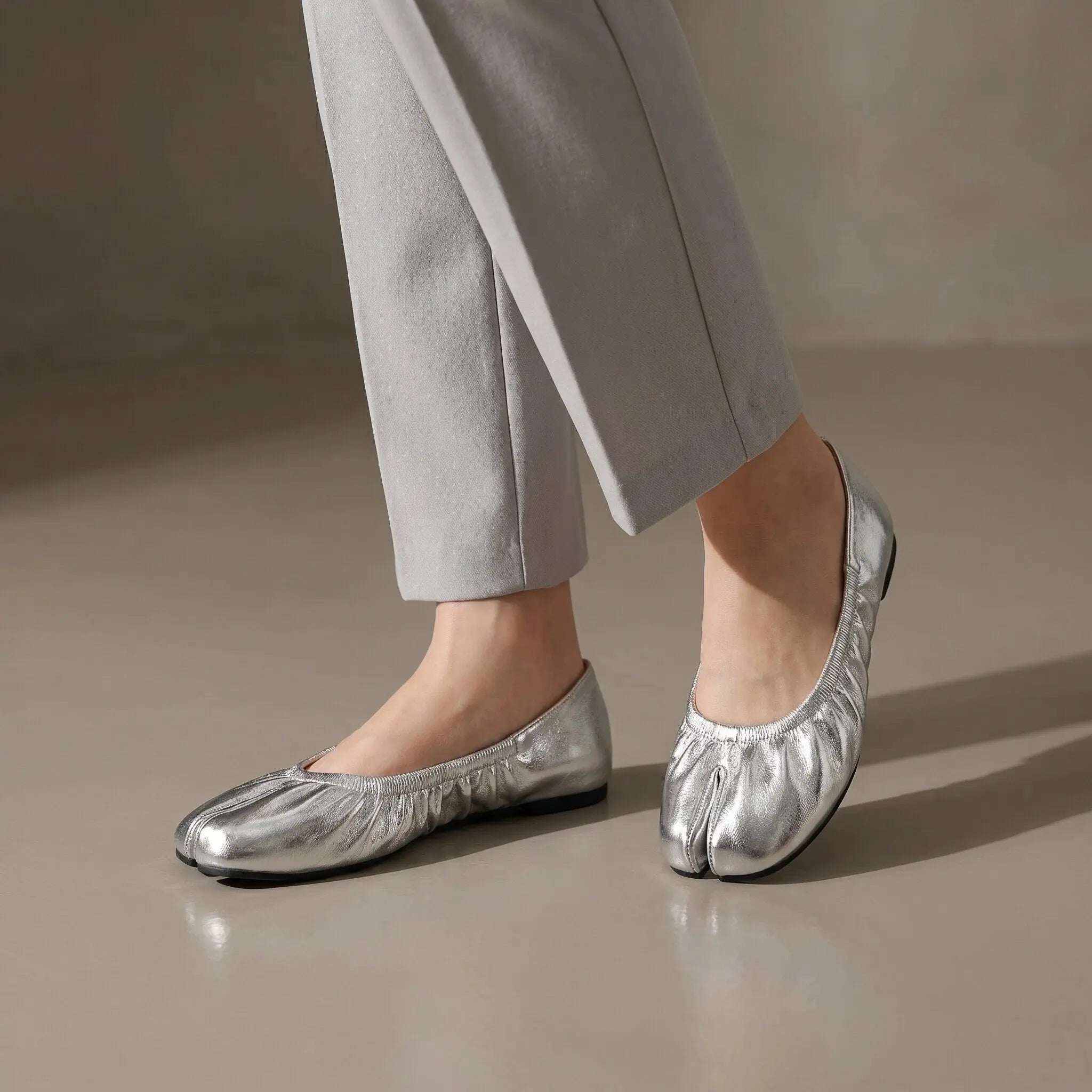 ZQW Ruched Tabi Ballet Flats in silver, worn on feet close-up – split-toe allows natural movement, ruched detail adds ballet charm, cushioned insole for all-day comfort
