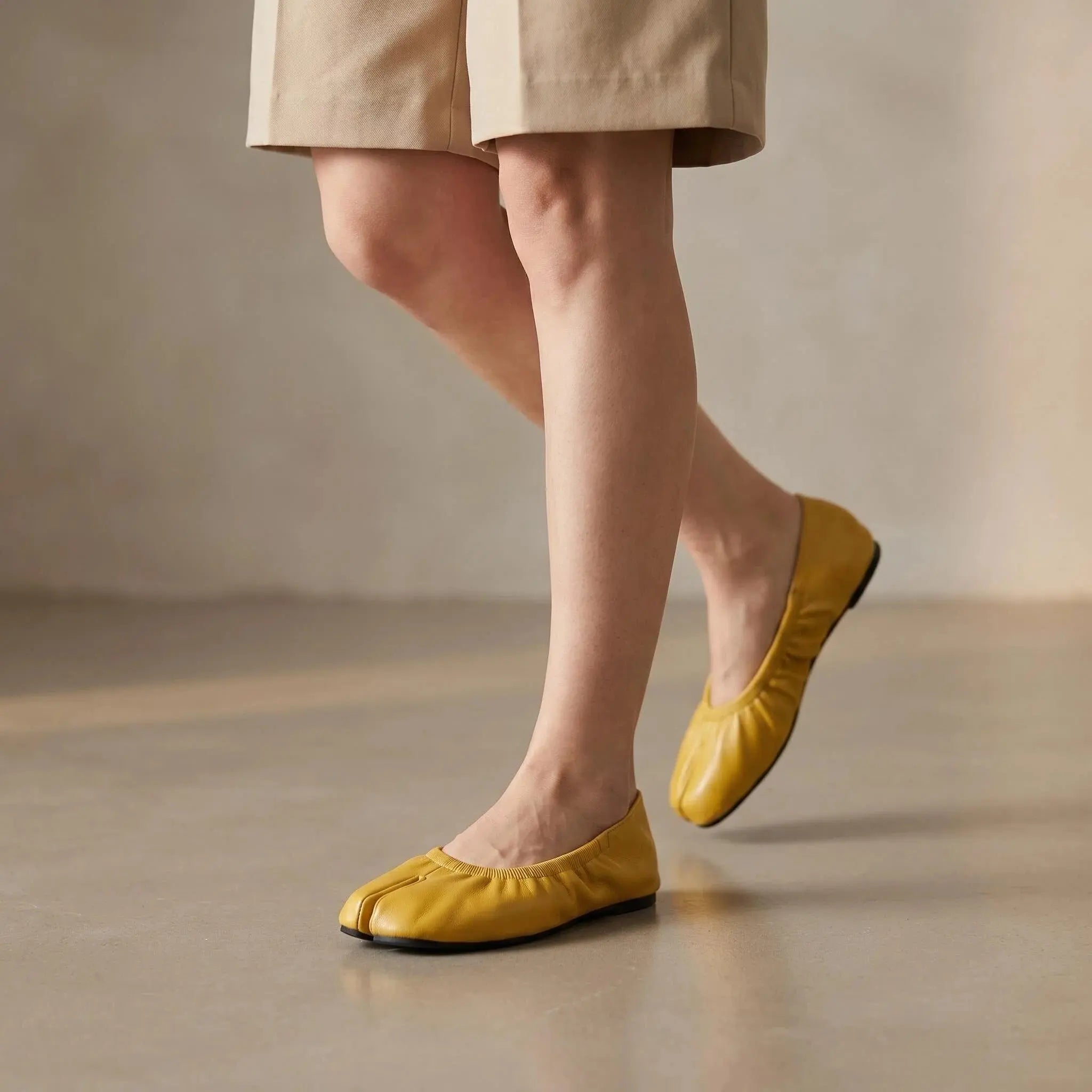 ZQW Ruched Tabi Ballet Flats in yellow, worn on feet close-up – split-toe allows natural movement, ruched detail adds ballet charm, cushioned insole for all-day comfort