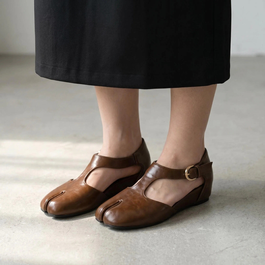 ZQW Tabi Mary Jane Flats in brown, worn on feet close-up – T-strap secured with buckle, side cutouts allow airflow, split-toe freedom, all-day comfort